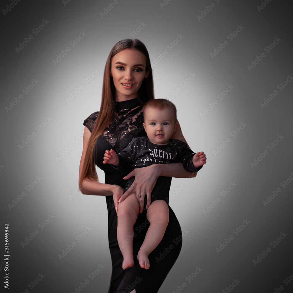 Sexy young mother with little baby girl in studio Stock Photo ...