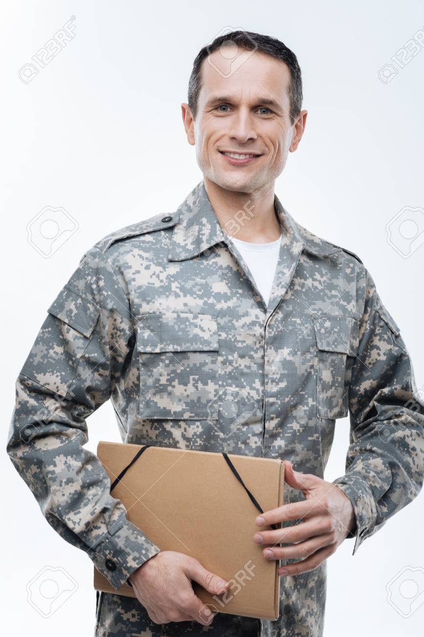 Military Documents. Nice Positive Military Man Smiling And Looking ...