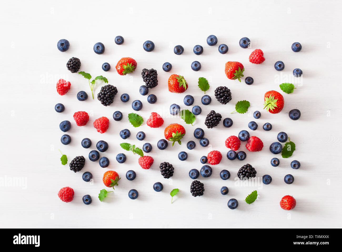 assorted berries over white background. blueberry, strawberry ...
