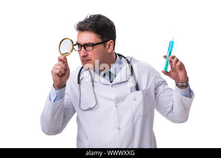 Young doctor with a magnifying glass and a syringe isolated on w ...