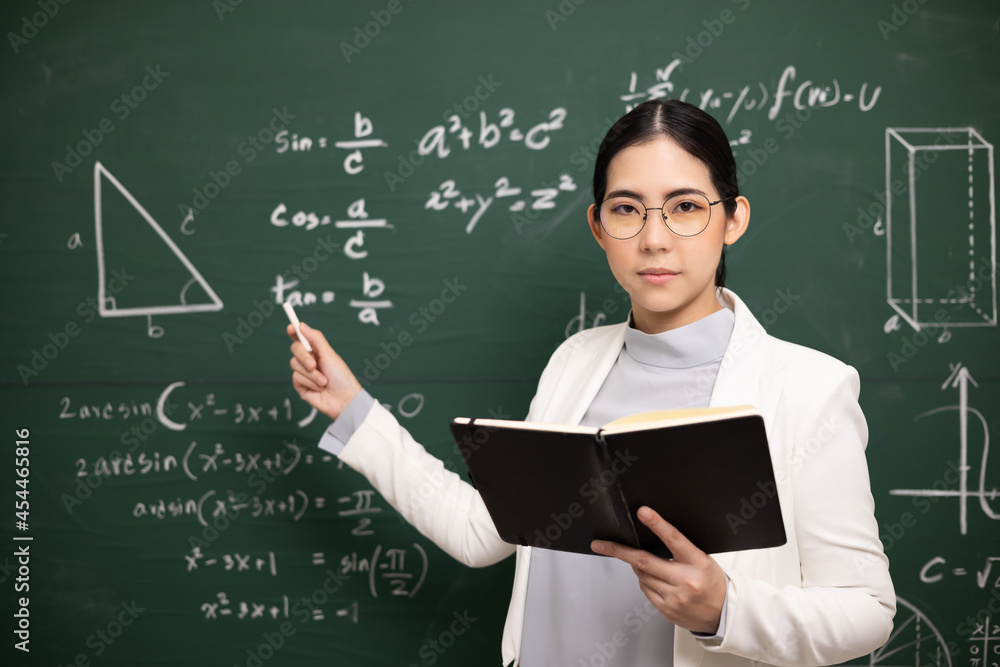 Young asian teacher woman teaching holding book and chalk video ...