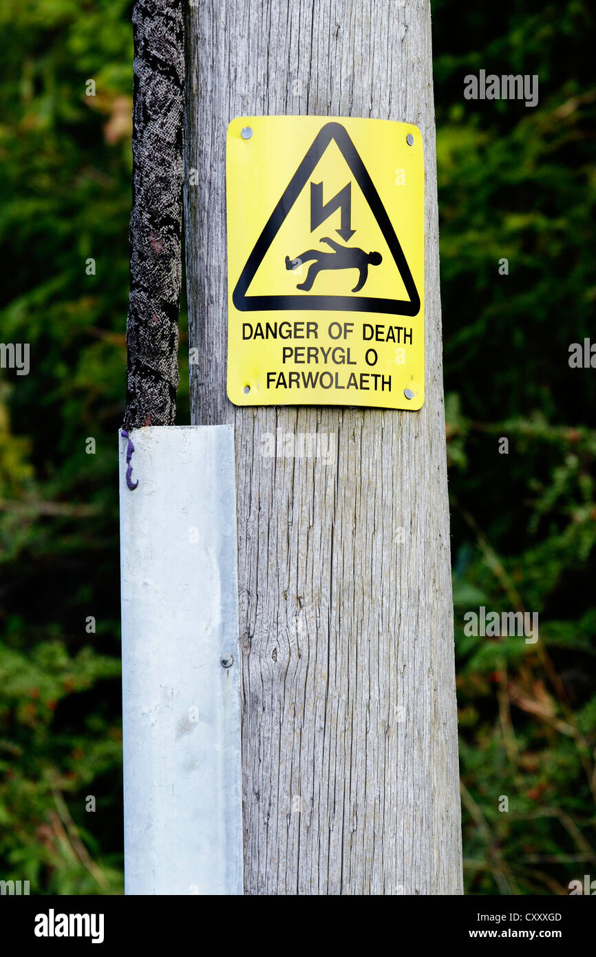 A bi-lingual sign in English and Welsh on a pole warning of the ...