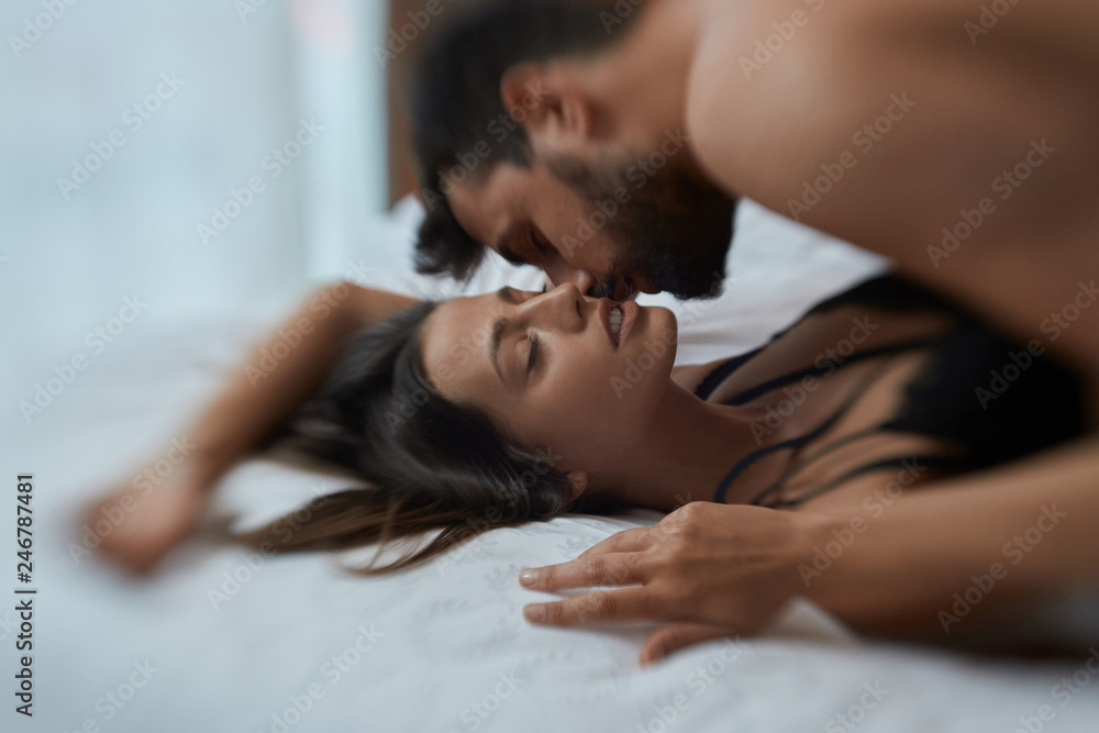Sexy lovers in passion - couple in bed having sex.. Stock Photo ...