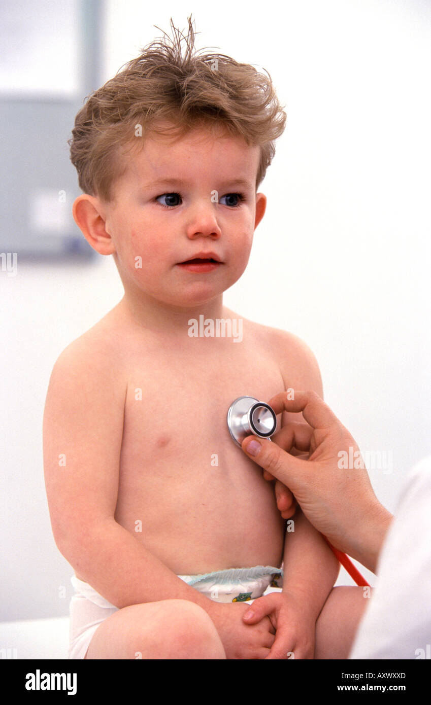 Little boy is checked with a stethoscope in the health care centre ...