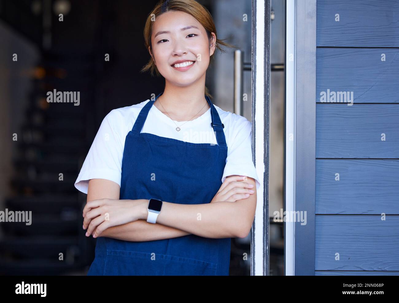 Happy, cafe and portrait of Asian woman at door for welcome ...