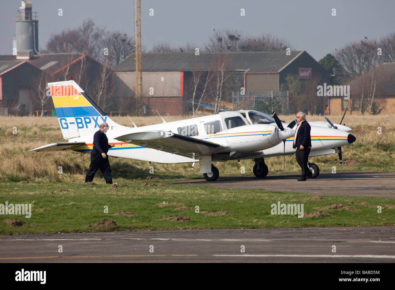 Piper PA-34-200T Seneca 11 G-BPXX parked on hardstand with pilots ...