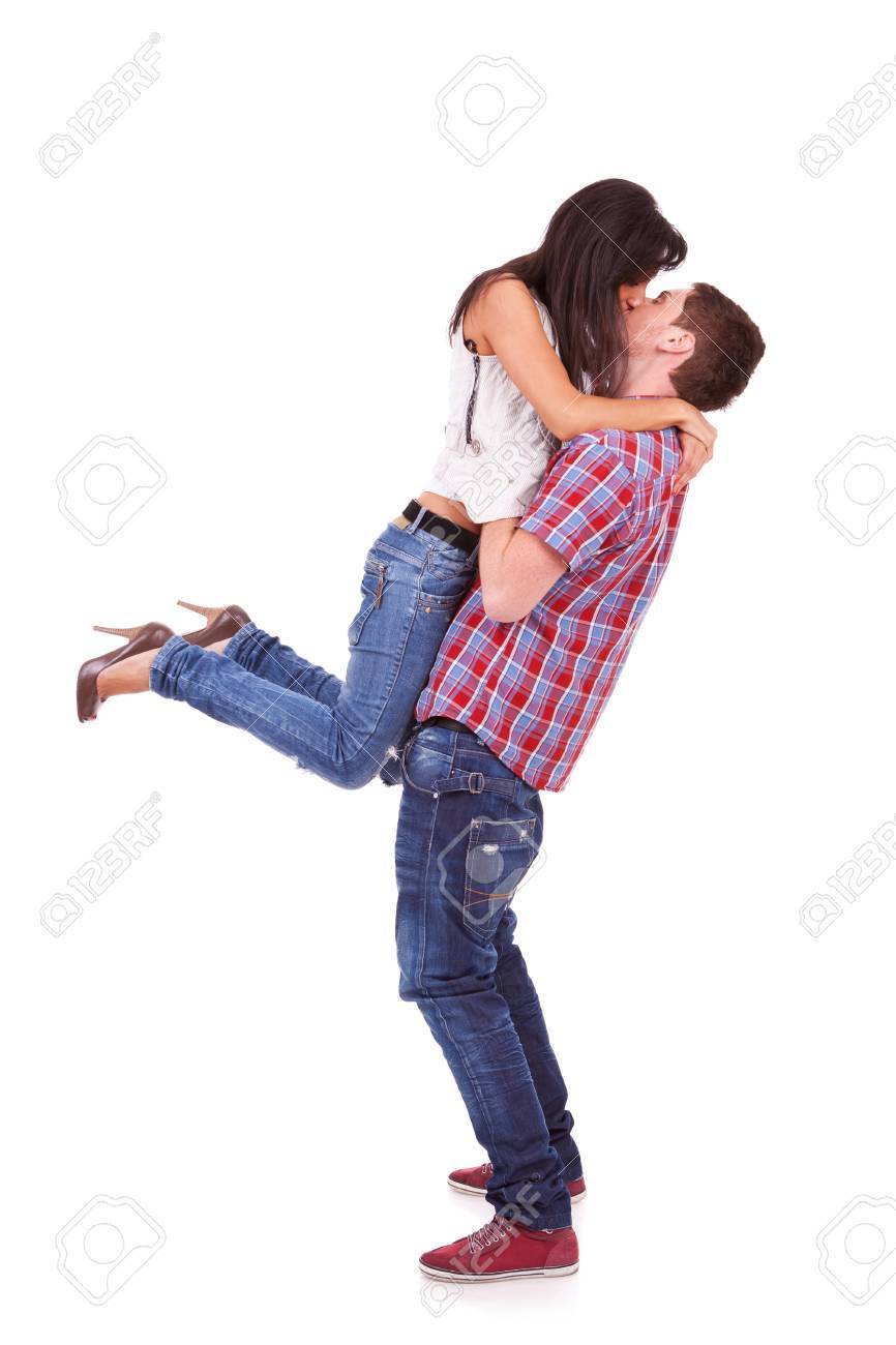 Side View Of A Young Woman In Her Boyfriend's Arms Kissing Him ...