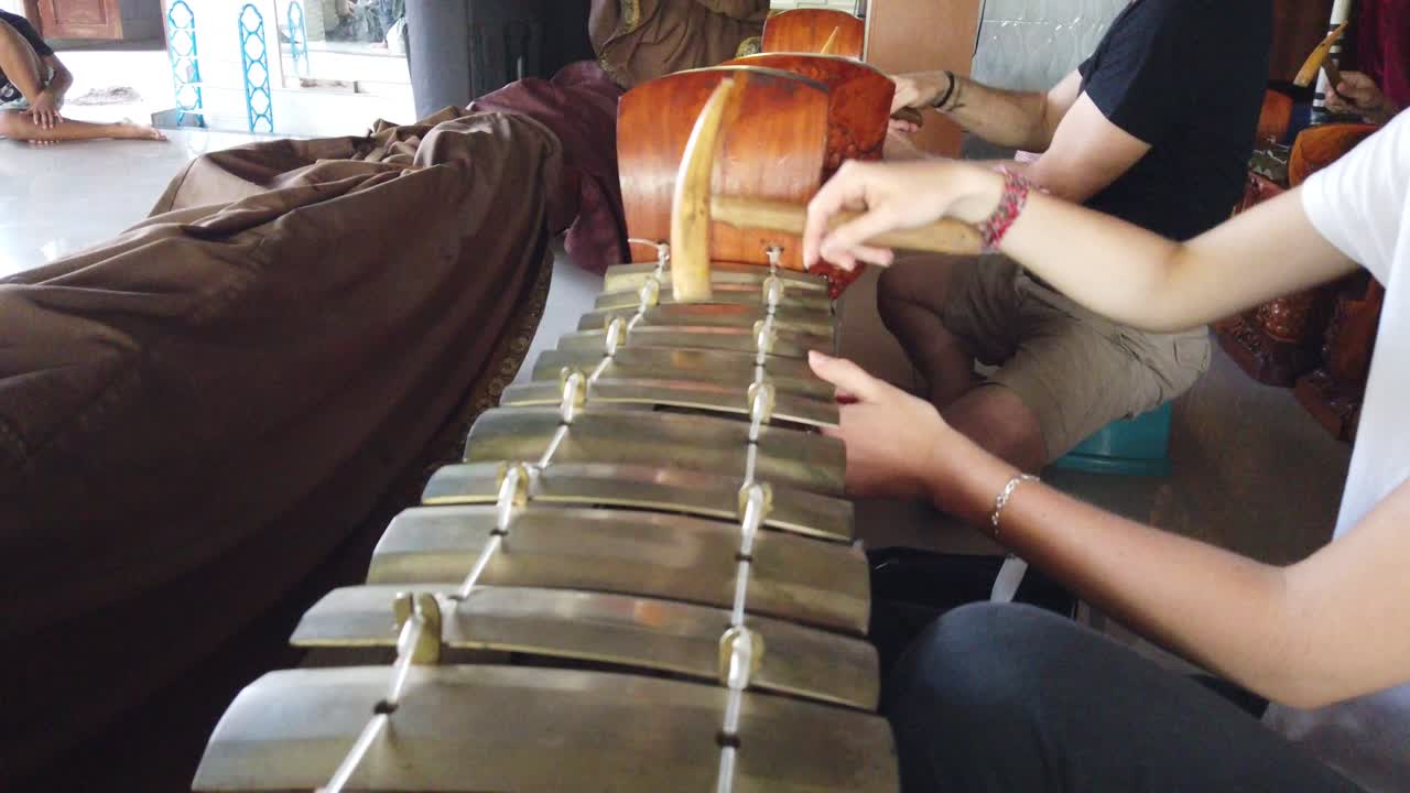 Premium stock video - Hands of musician playing gamelan instrument ...