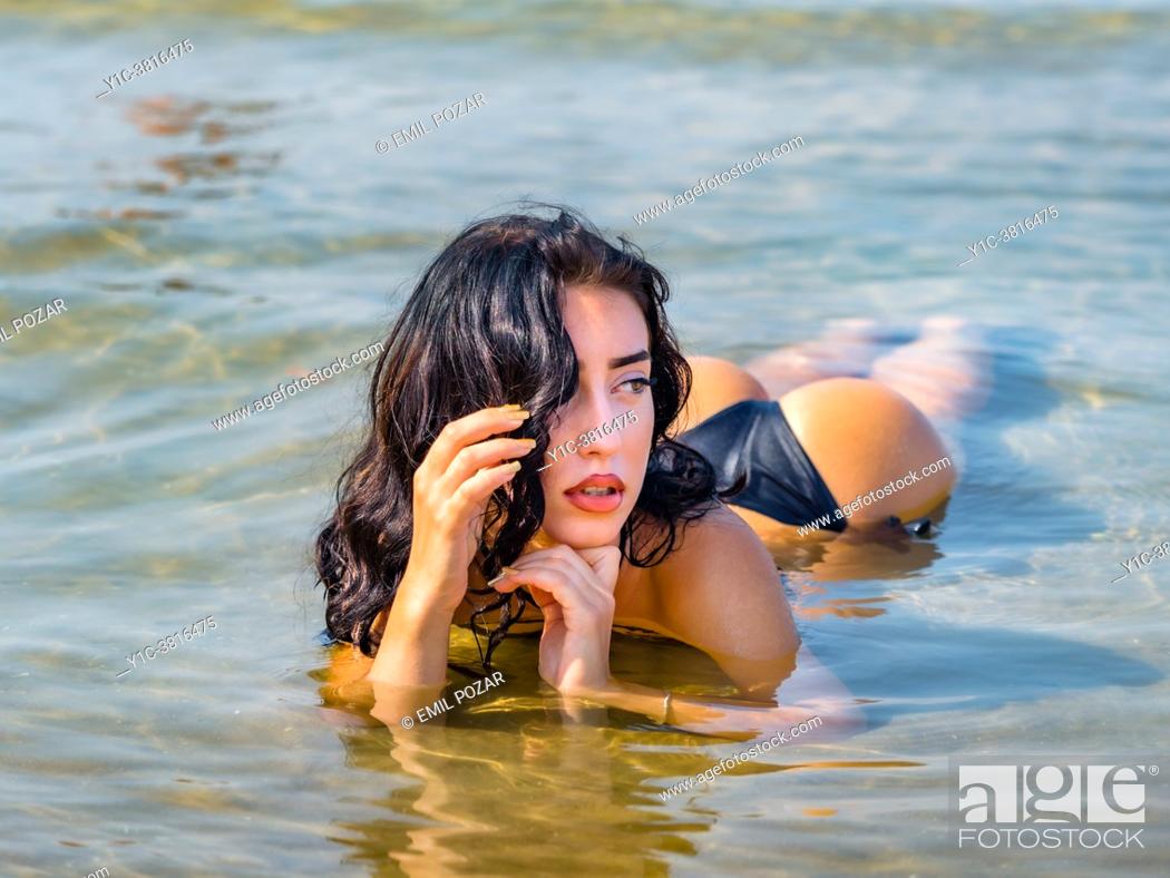 Teen girl sexy in shallow sea water on beach, Stock Photo, Picture ...