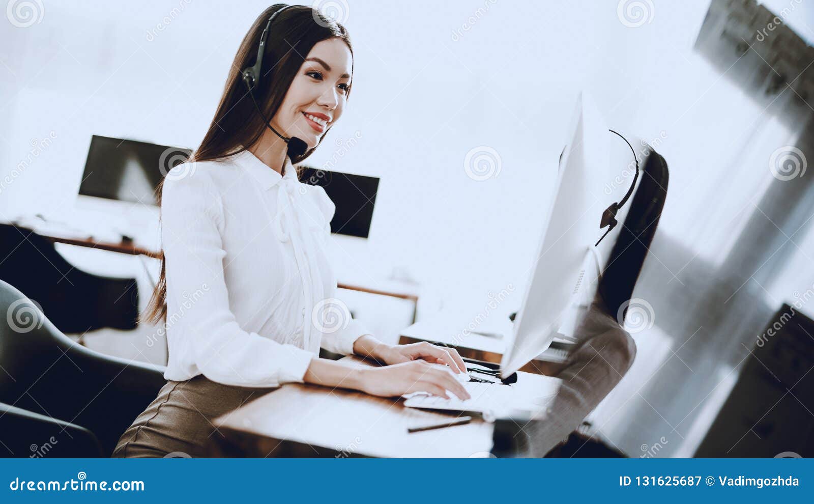 Young Woman Sitting and Working in Call Center. Manager with ...