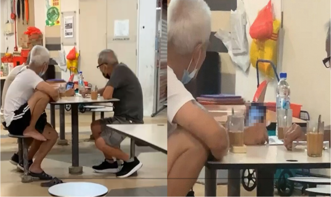 Old uncles engrossed watching porn together at hawker centre ...