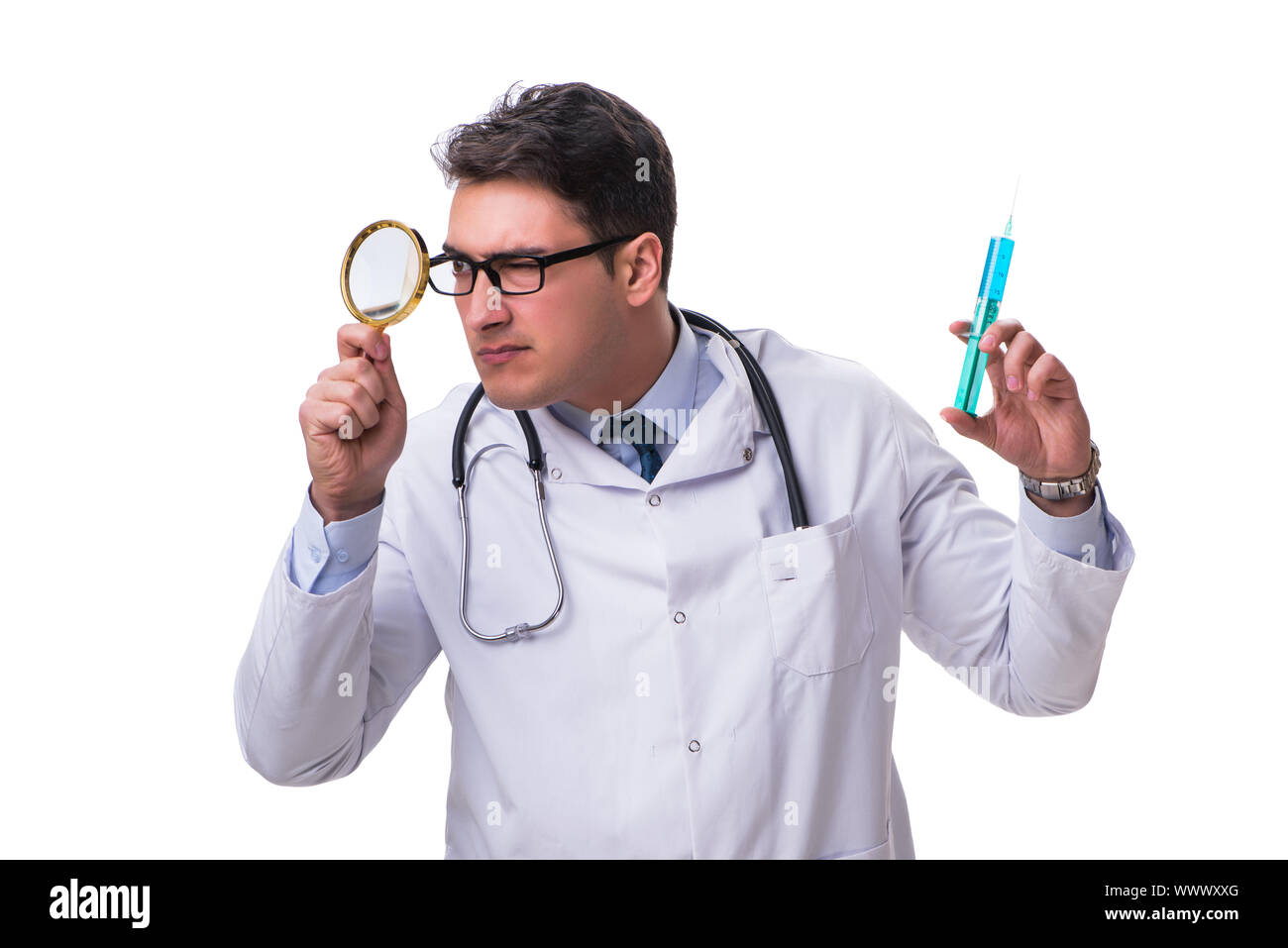 Young doctor with a magnifying glass and a syringe isolated on w ...