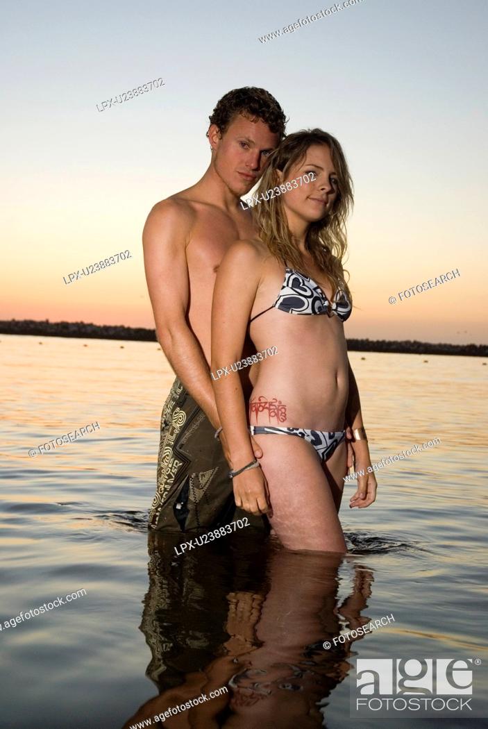 Sexy couple are in the water after sunset, Stock Photo, Picture ...