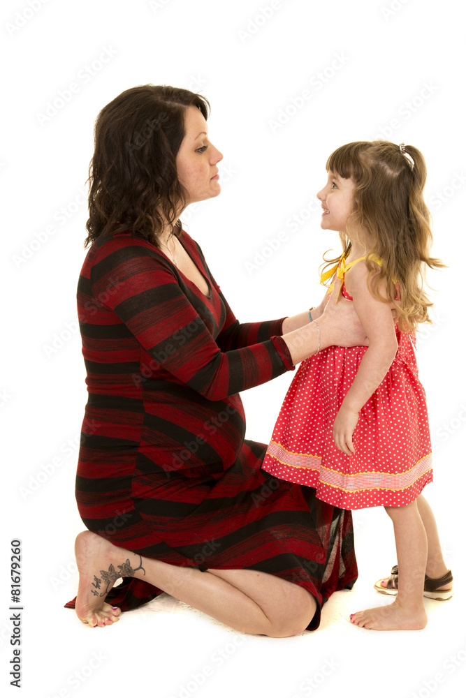 pregnant mom kneel and talk to small girl with one shoe on Stock ...