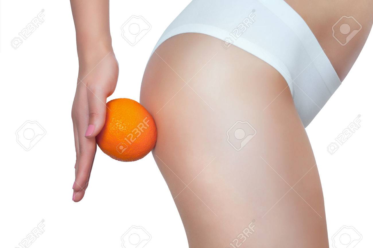 A Thin Girl Is Holding An Orange By Her Ass. Concept Of Sport And ...
