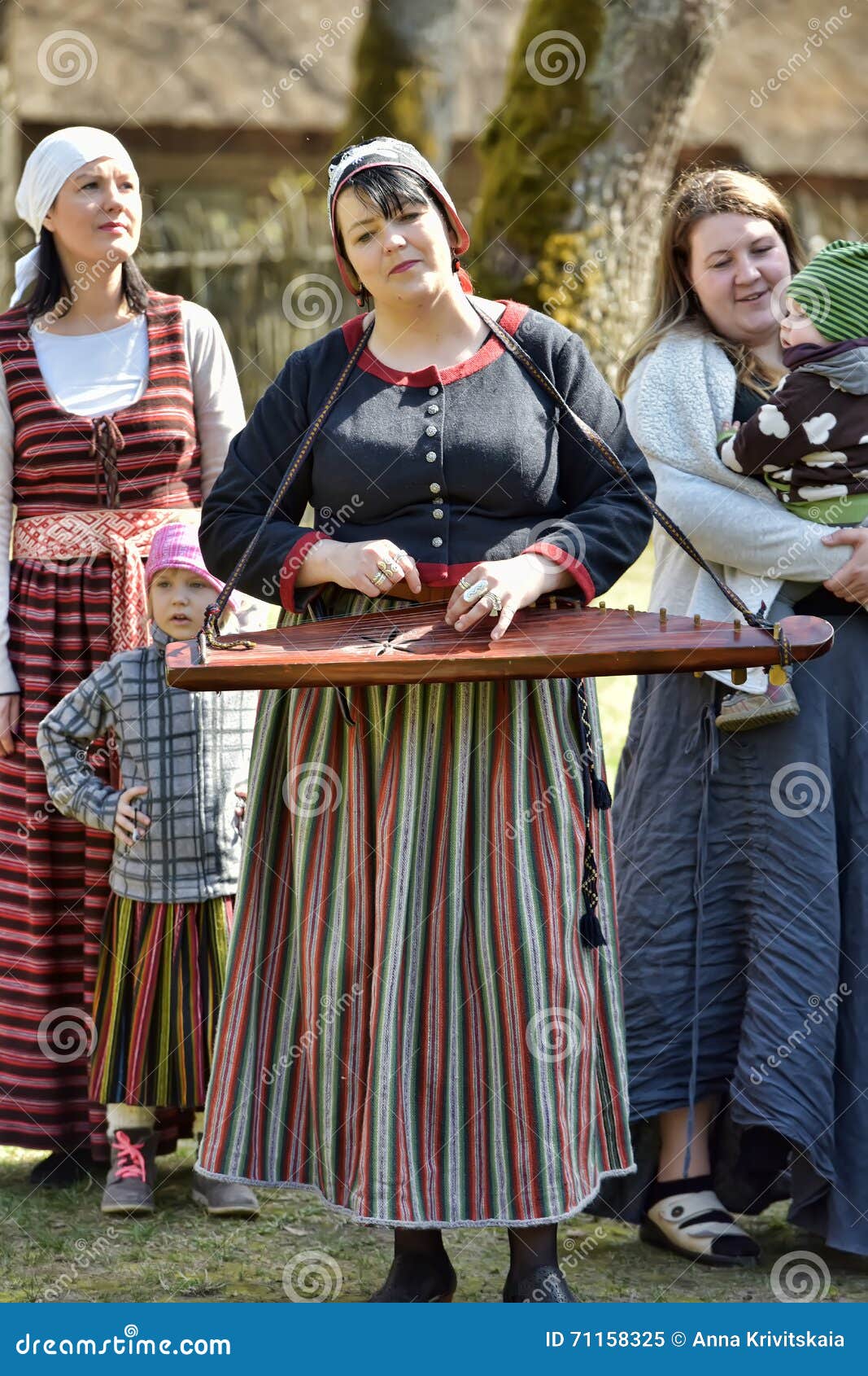 Latvian Woman in National Dress with a Musical Instrument ...