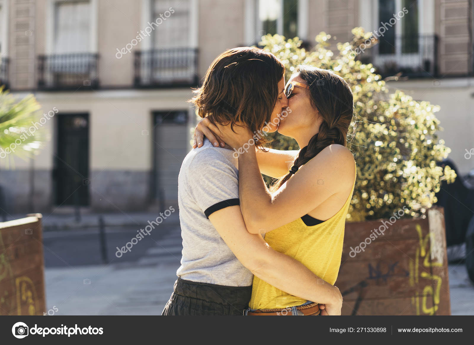 A couple of lesbian women kissing on a Madrid street. Same sex ...