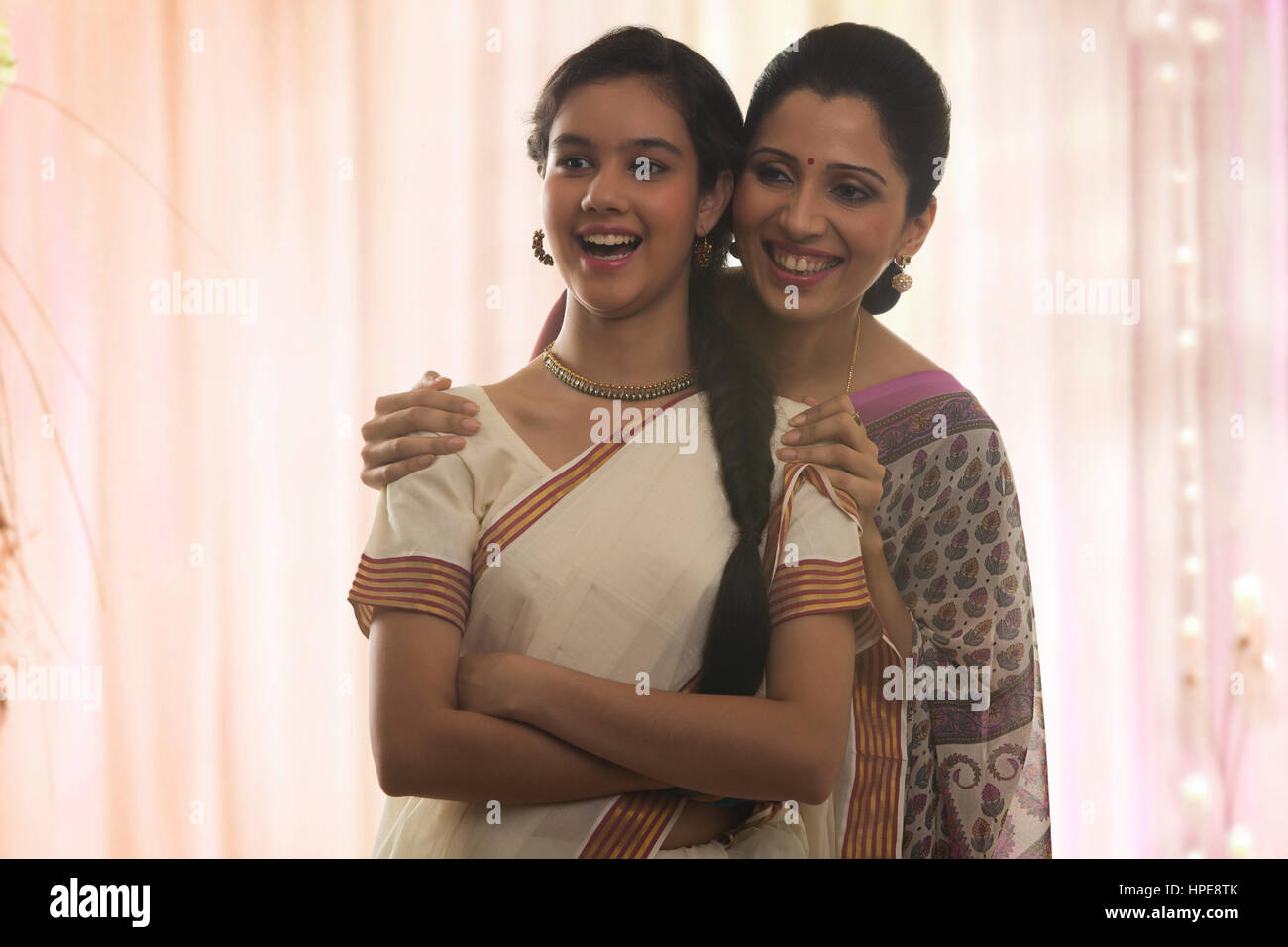 Smiling teenage girl in sari with her mother Stock Photo - Alamy