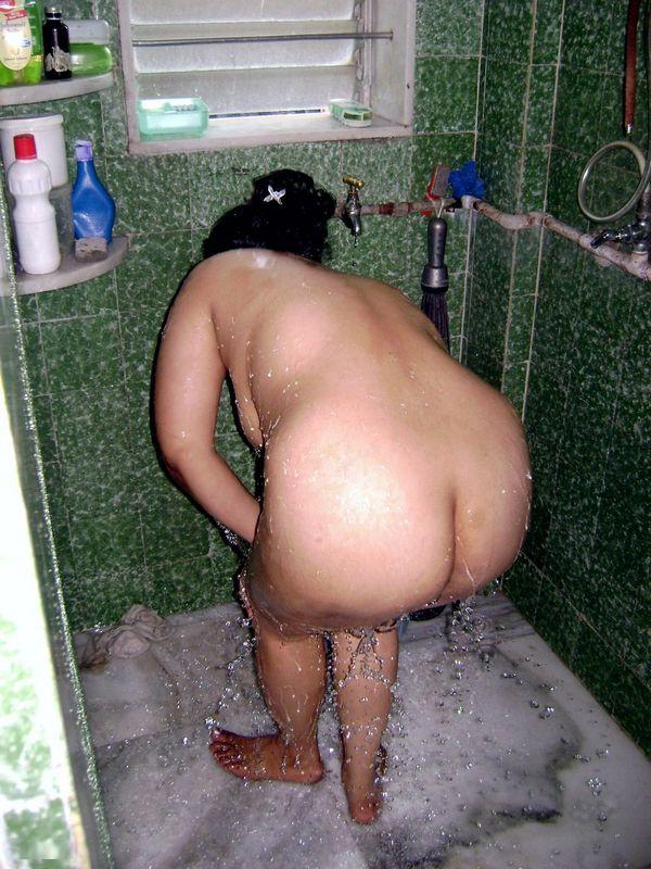 Indian fatty washes her clothes while taking a shower at the same ...