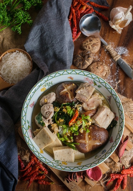 Premium Photo | Boiled rice with pork, porn bone and thai pork ...