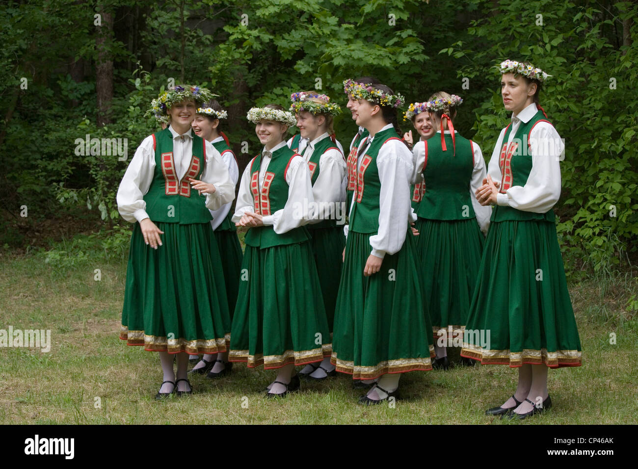 Latvia - Folk festival. Group of girls in traditional costume with ...