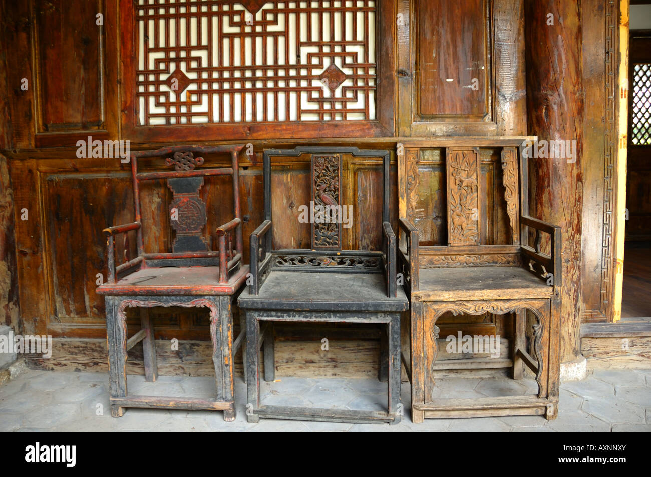 Traditional wooden chairs in a local residence. Lijiang, Yunnan ...