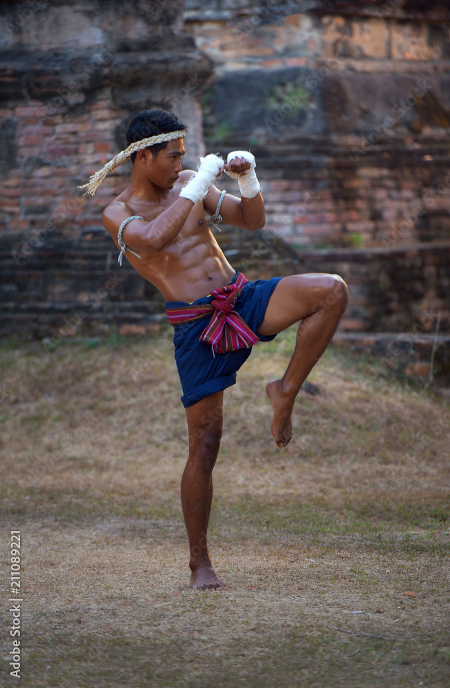 The fighter tying tape around his hand preparing to fight,Thai ...