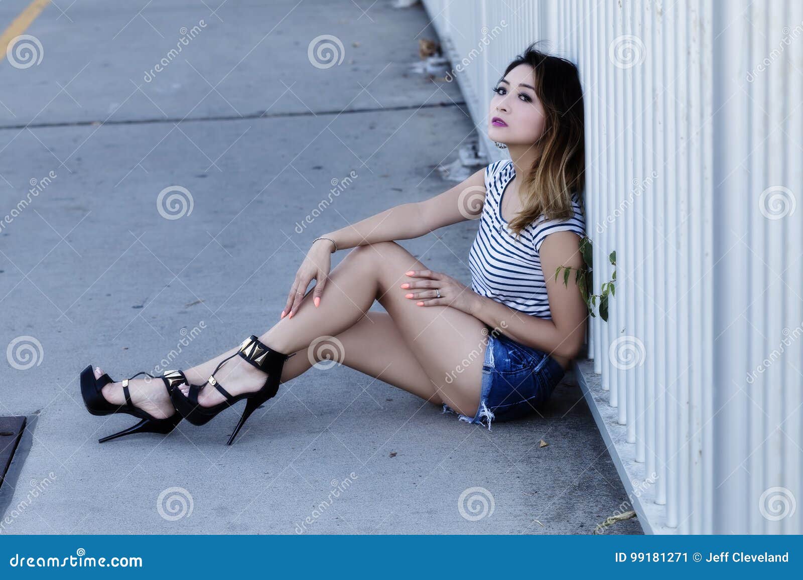 Asian American Woman Sitting in Jean Shorts and Top Stock Image ...