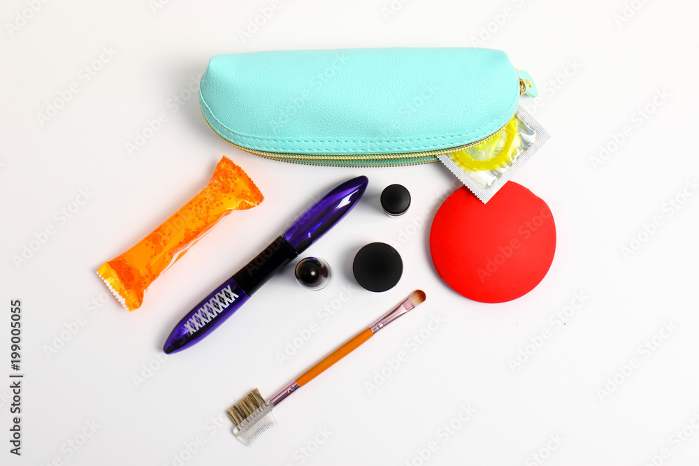 cosmetic bag for a modern girl. Lipstick, mascara, powder and ...