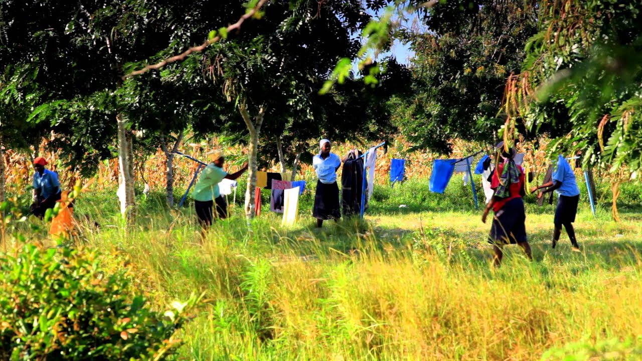 Students and workers taking a break in a Kenyan town. - Stock ...