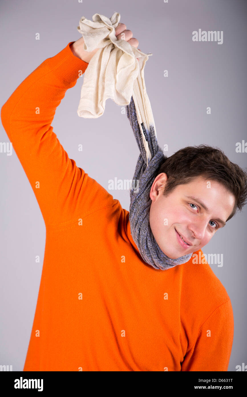 Man on background try hang itself by scarf Stock Photo - Alamy