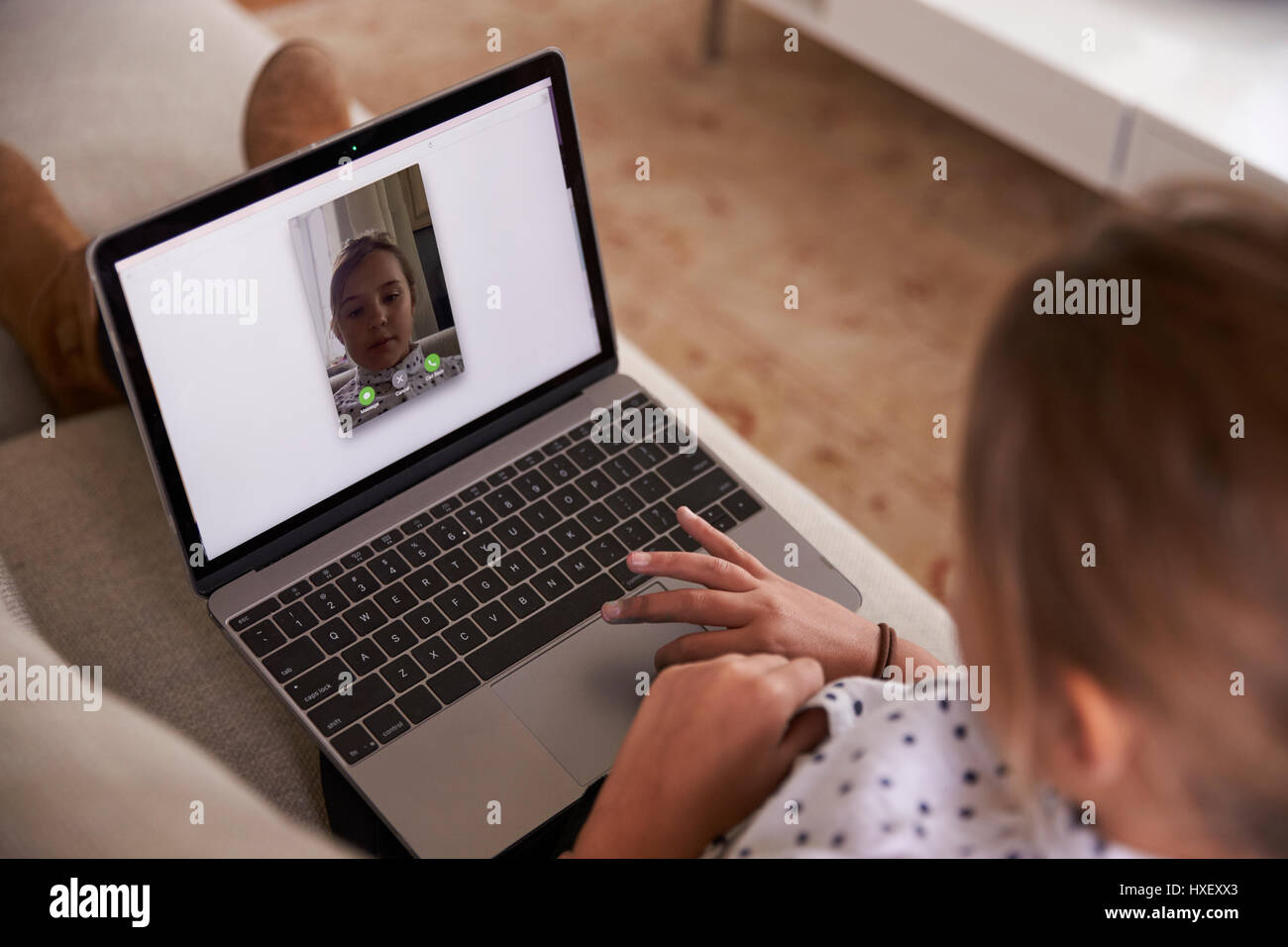 Girl Sitting On Sofa Using Laptop Computer For Video Call Stock ...