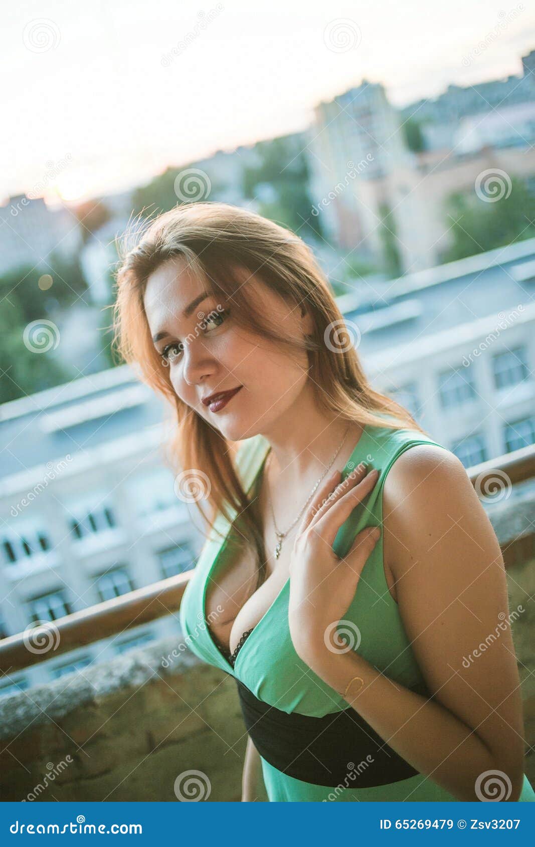 Young Beautiful Busty Girl in the Green Dress with Stock Image ...
