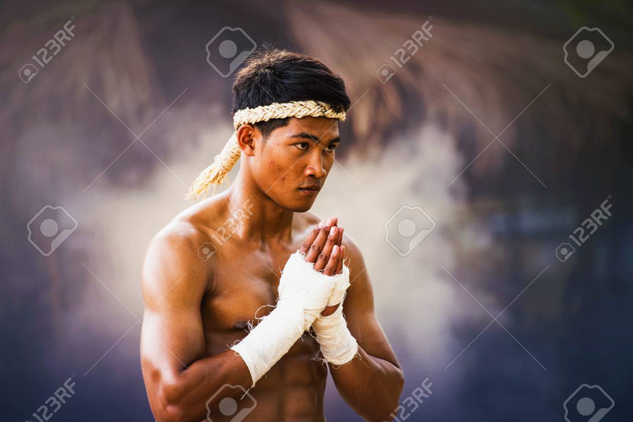 The Fighter Tying Tape Around His Hand Preparing To Fight,Thai ...