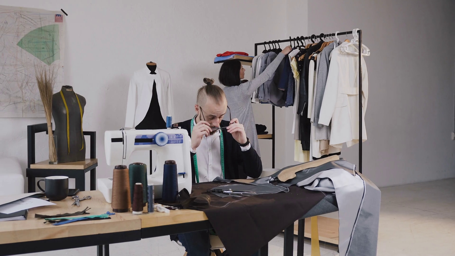 Tailor Fashion Designer Sits On Workplace At Stock Footage SBV ...