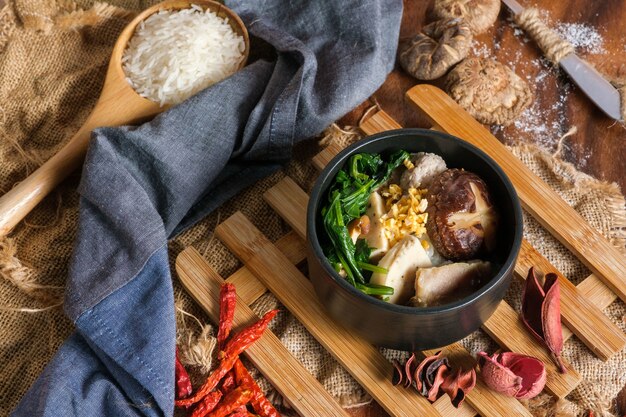 Premium Photo | Boiled rice with pork, porn bone and thai pork ...