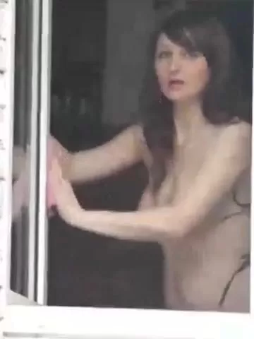 Filmed a naked neighbor as she washes the window watch online