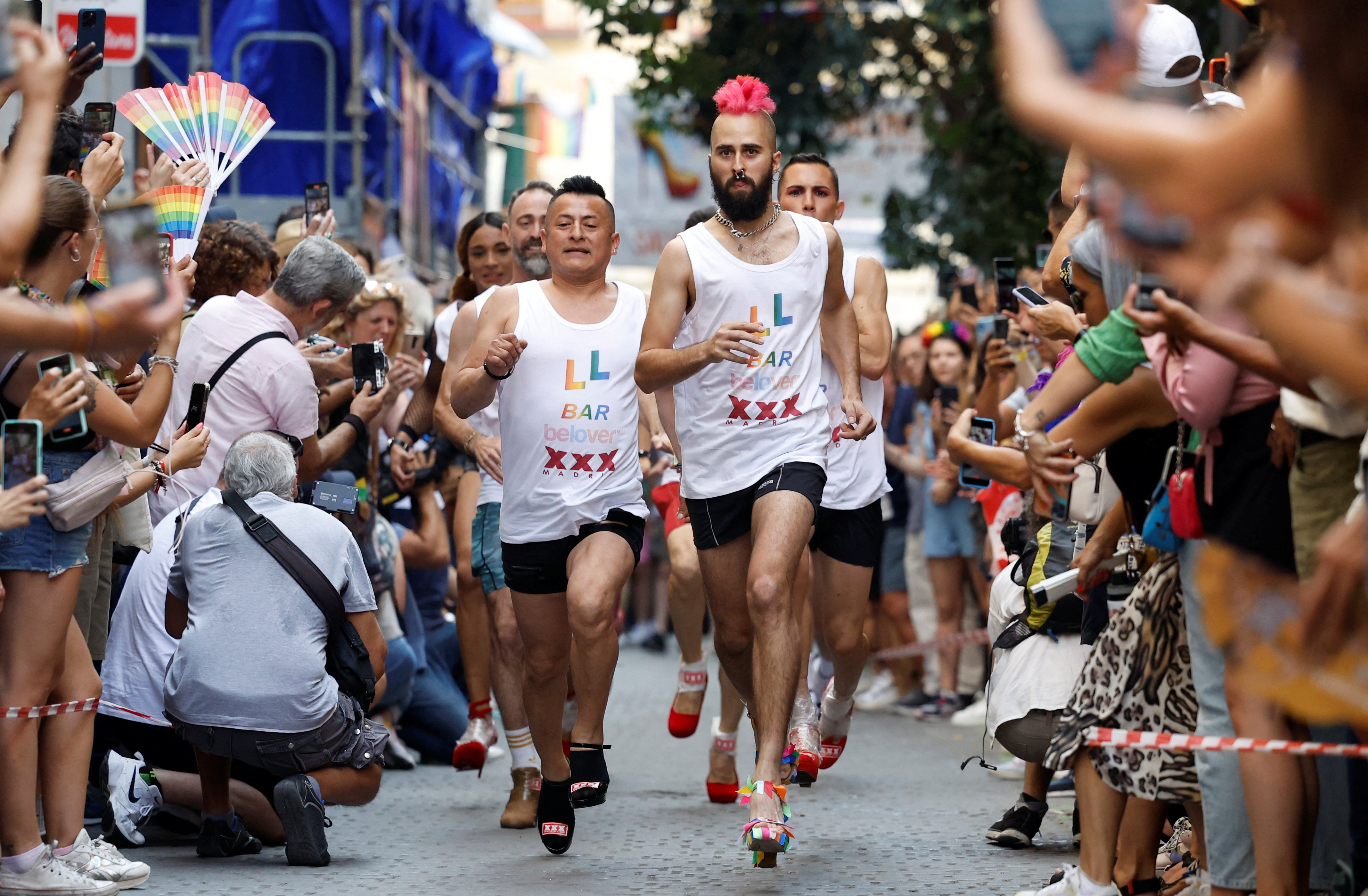 Ready, try to stay steady, go! Men in high heels race at Madrid ...