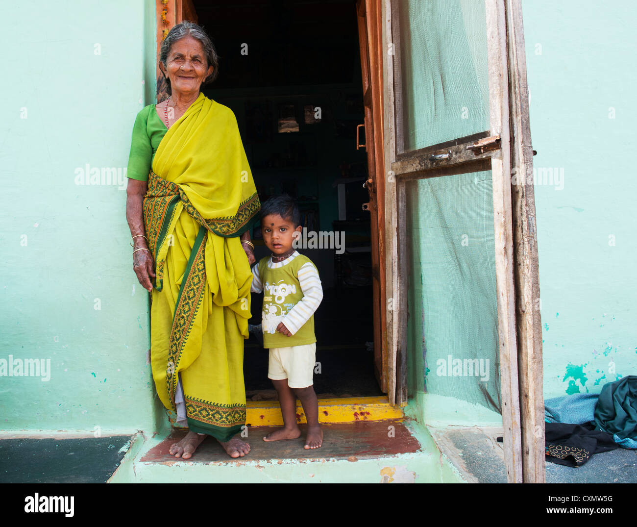 Indian grandmother and baby boy in a rural indian village. Andhra ...