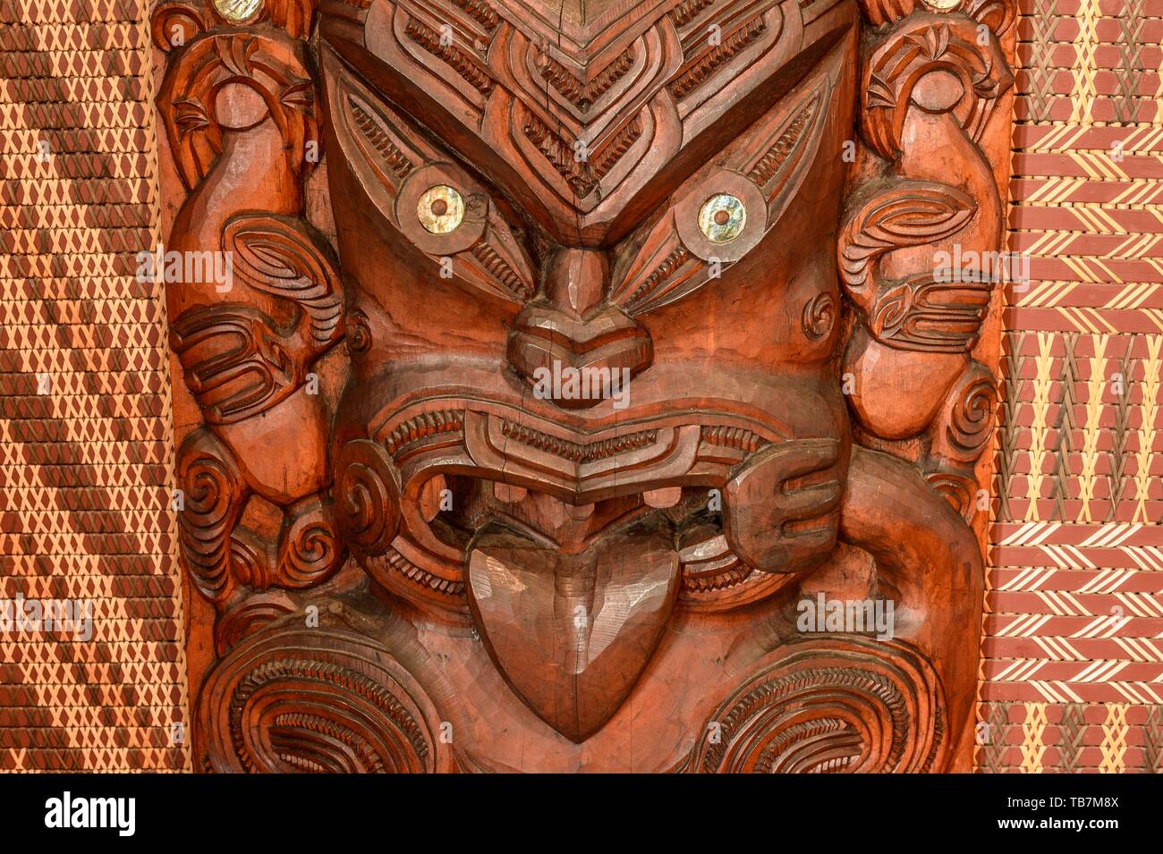 Figure, face, traditional Maori carving in the assembly hall Te ...