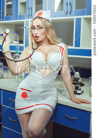 Sexy nurse with big breasts stands in the - Stock Photo [58603602 ...