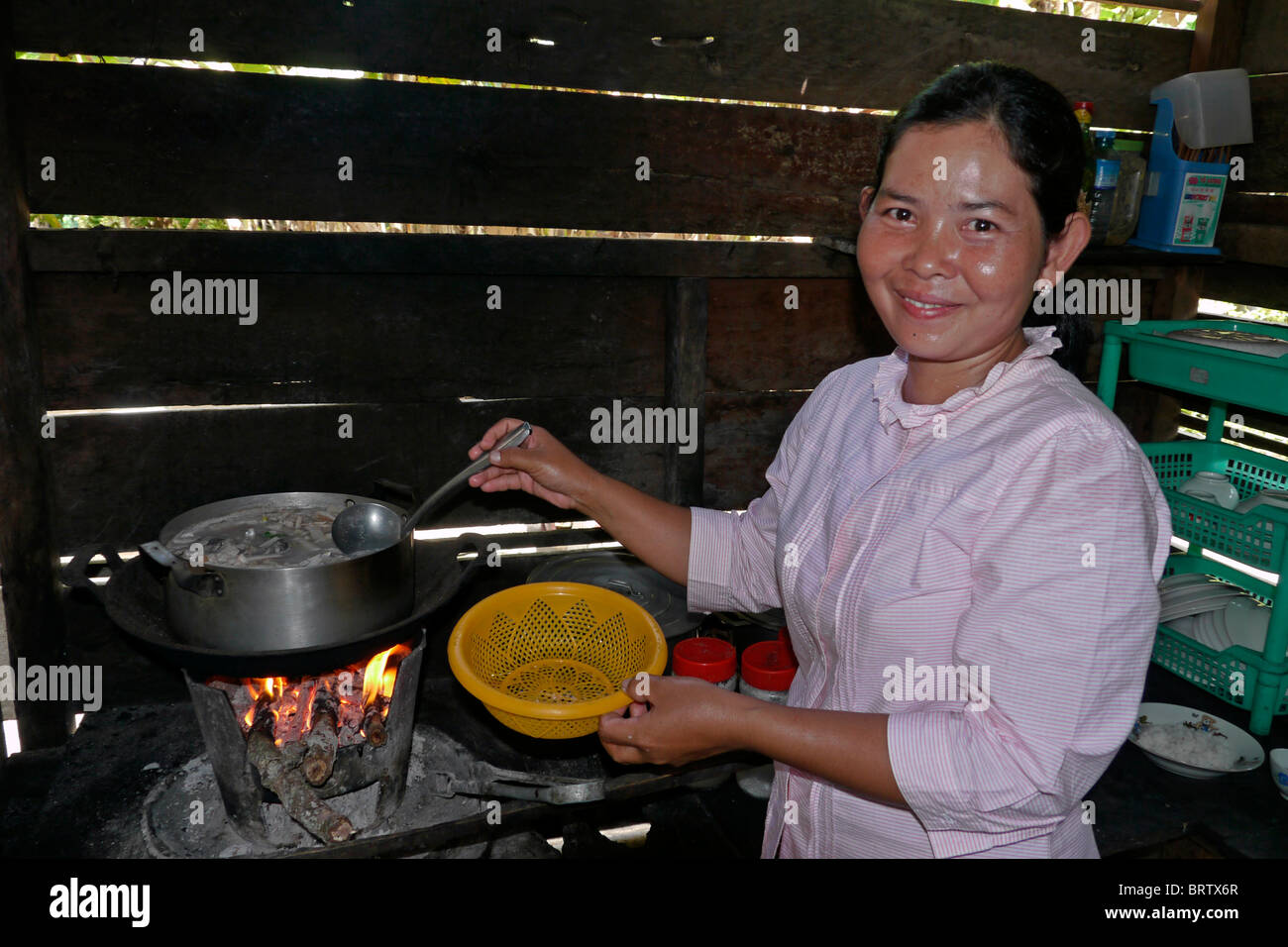 CAMBODIA Ms Porn Lian cooking meal with fish, Ban Bung village ...