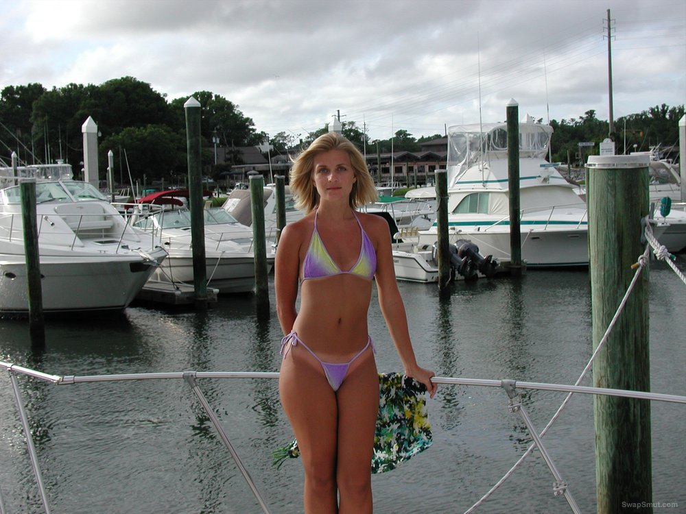 Beautiful blonde wife nude on a boat and enjoying female company