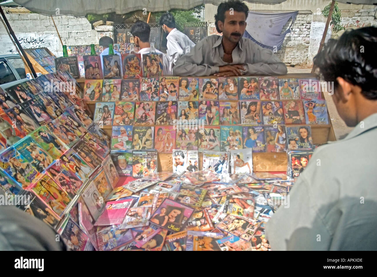 Pakistani men shopping for soft porn pornography VCDs and DVDs ...