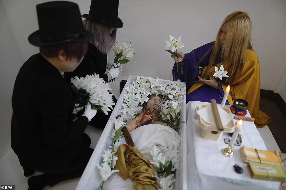 Japanese artist gives funerals for sex dolls and lets customers ...