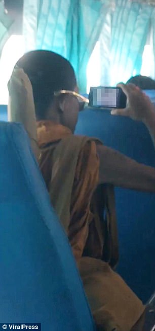 Thai 'monk' filmed watching PORN on a bus in Loei province | Daily ...