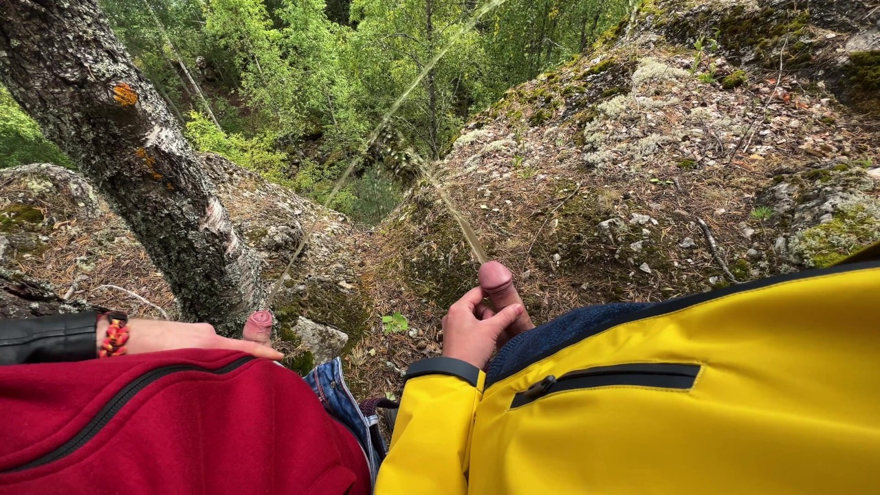 Two Tight Streams of Urine Cross in the Mountains. Pissing Outdoor ...