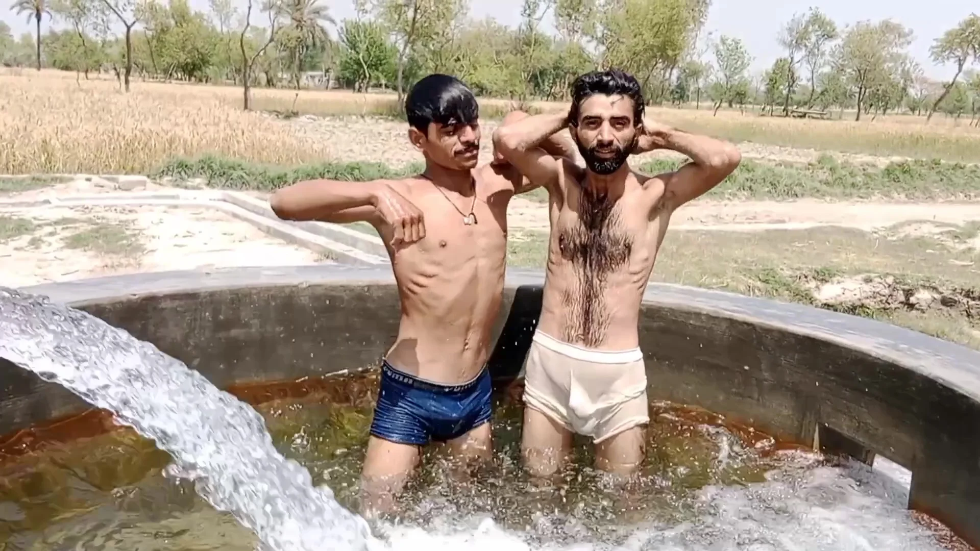 2 paki boys playing in water - ThisVid.com