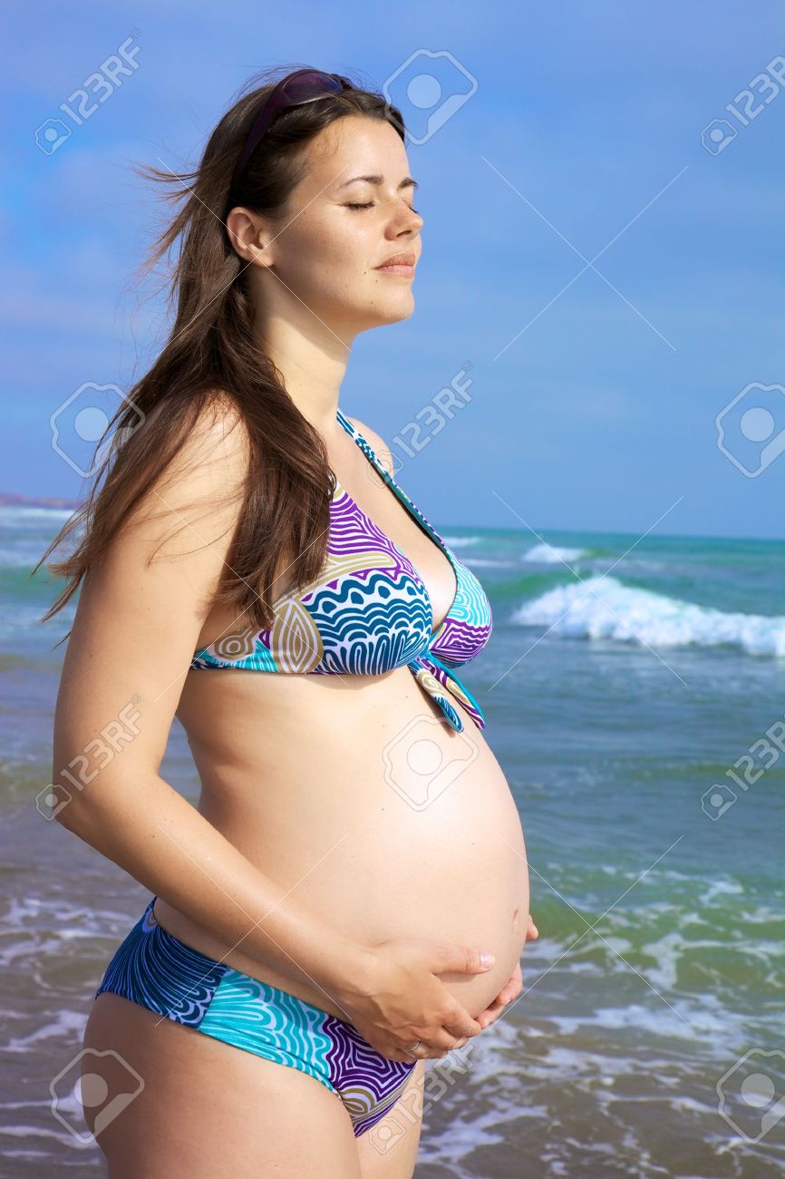 Beautiful Pregnant Female Model Relaxing In Front Of The Sea Stock ...