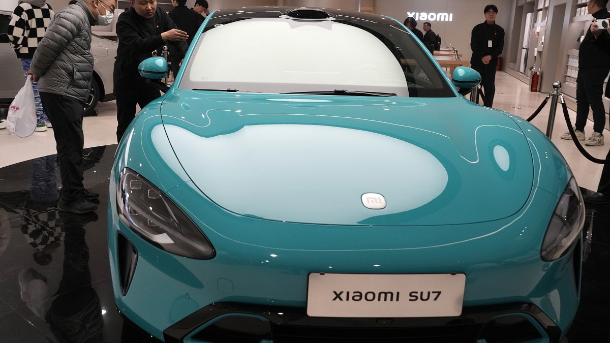 Chinese electronics maker Xiaomi launches 'connected' smart EV ...